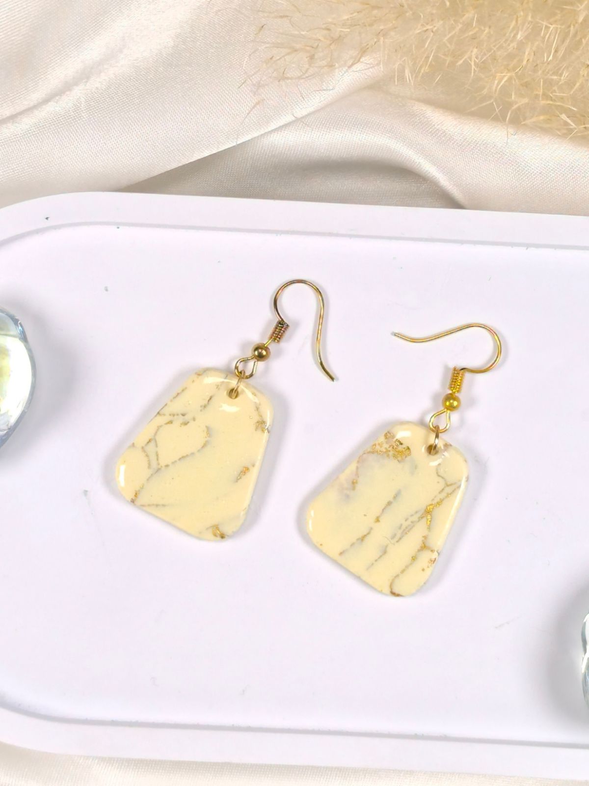 Large vanilla and gold dangle earrings