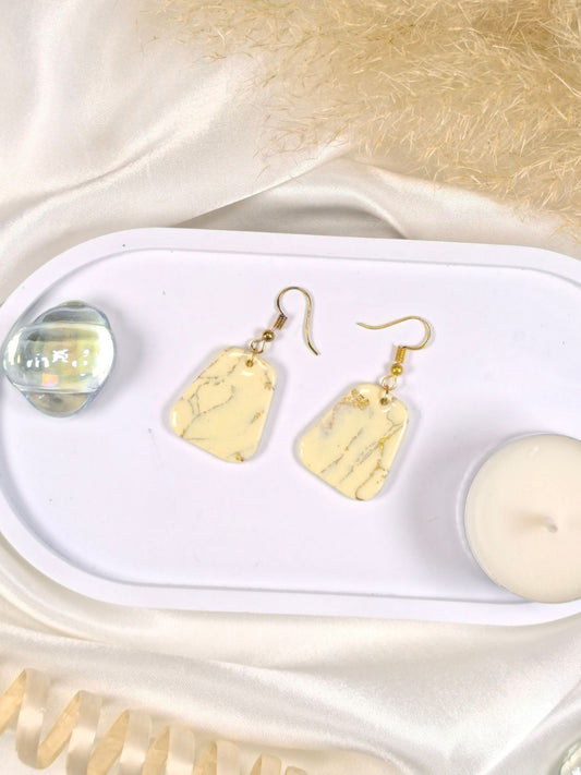 Large vanilla and gold dangle earrings