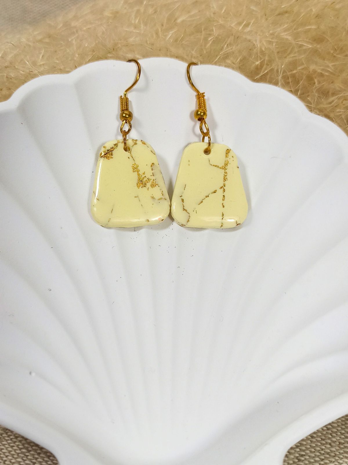Medium size vanilla and gold dangle earrings