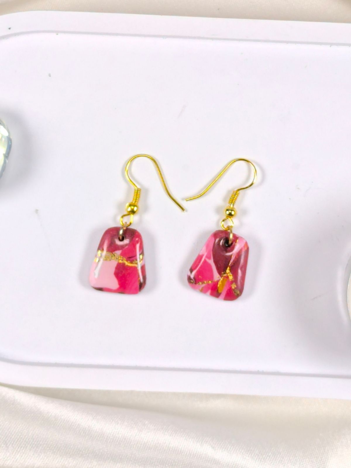 Short red pink and gold polymer clay earrings