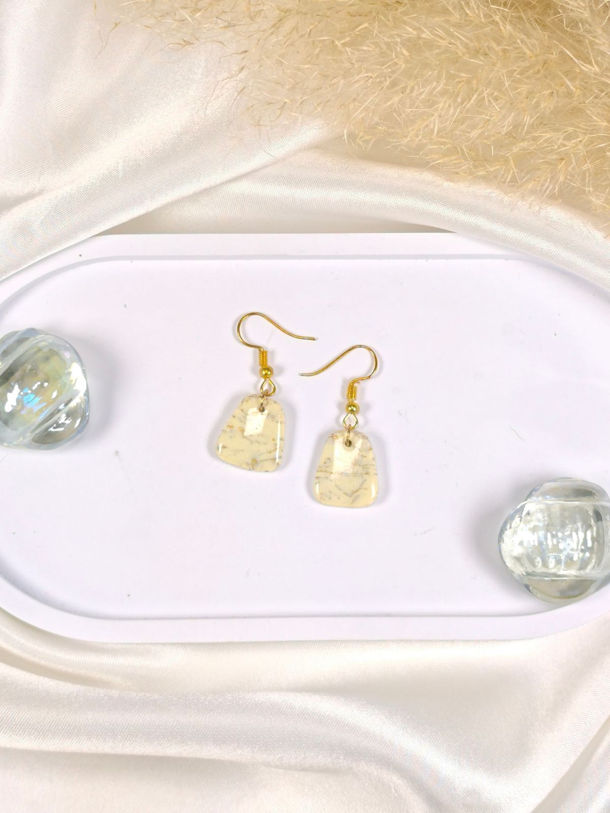 Small vanilla and gold dangle earrings