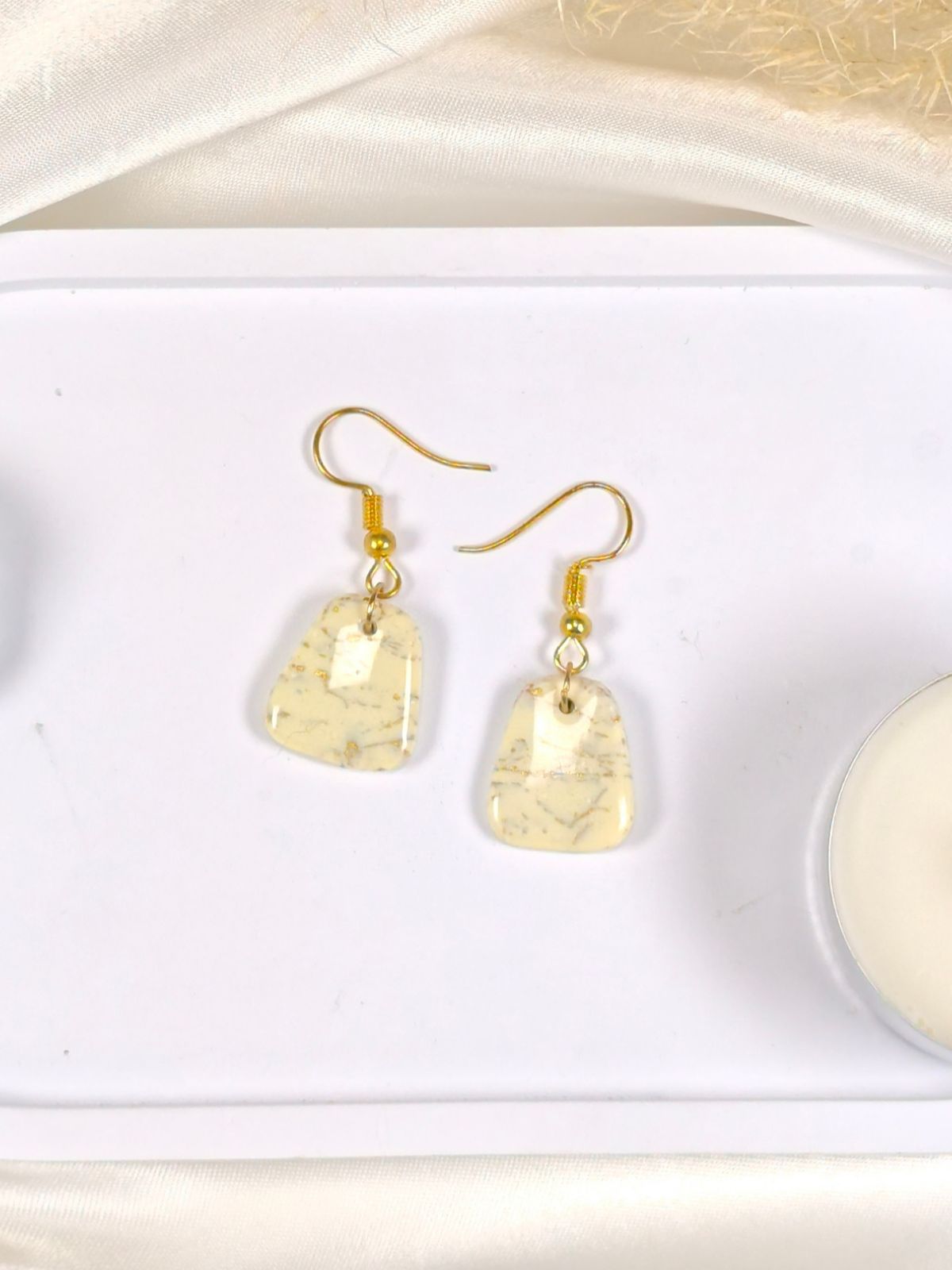 Small vanilla and gold dangle earrings