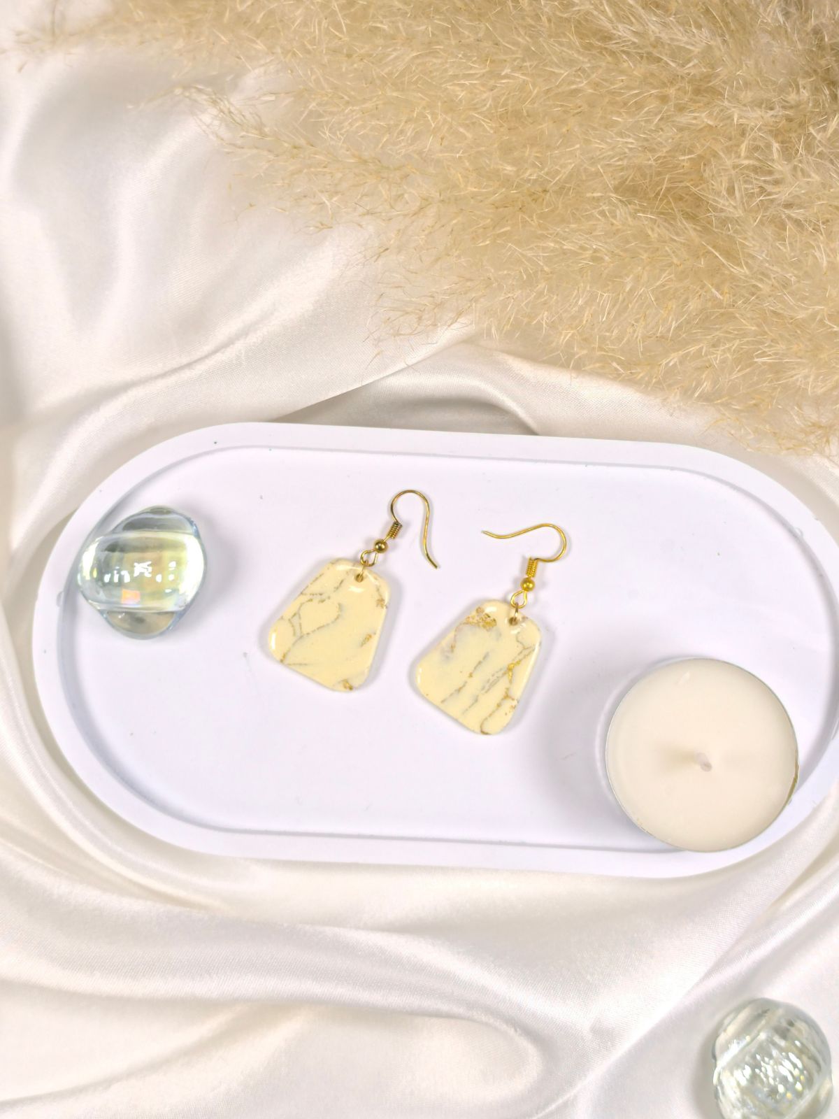 Large vanilla and gold dangle earrings