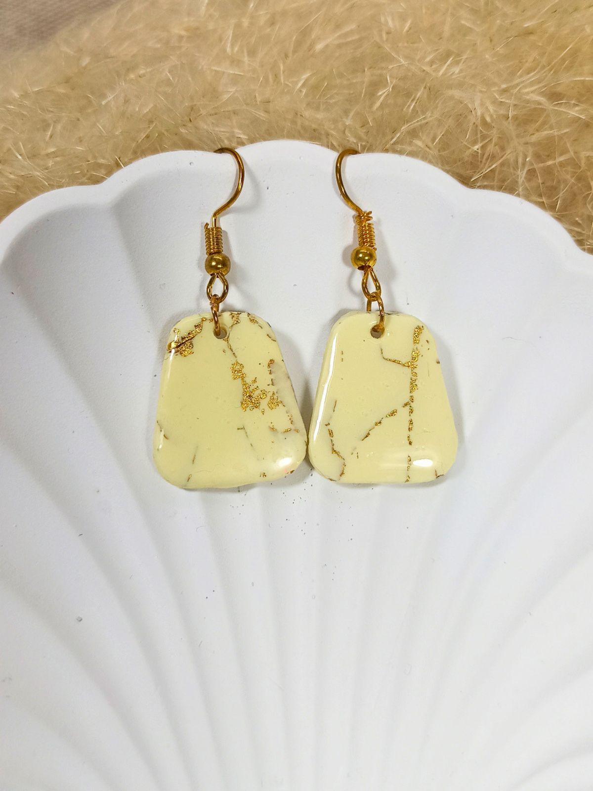 Medium size vanilla and gold dangle earrings
